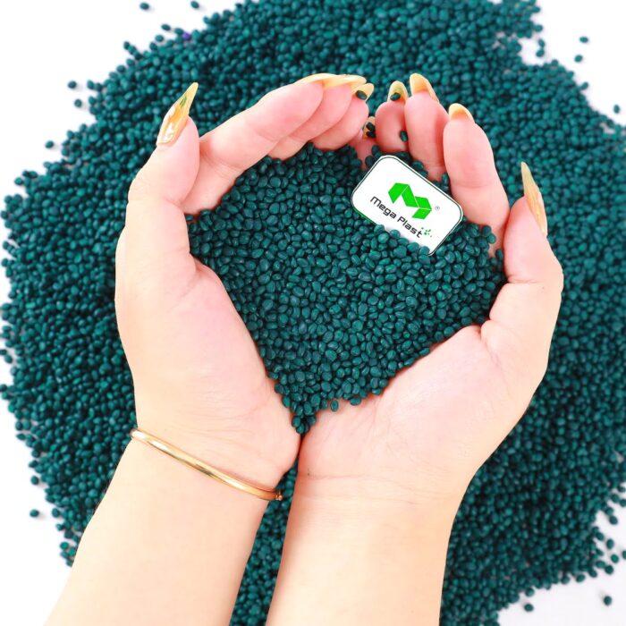 Close-up of green masterbatch pellets, showcasing the uniform dispersion of pigments for consistent color throughout the final product