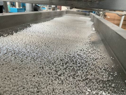 Close up white masterbatch in line production